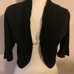 Juniors Bolero Cut Black Sweater.See the scalloped edges around the whole